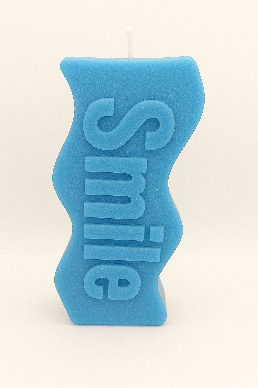 Blue Smile Candle with cheerful smile message in soft blue color, hand-poured soy wax for calming ambiance.
