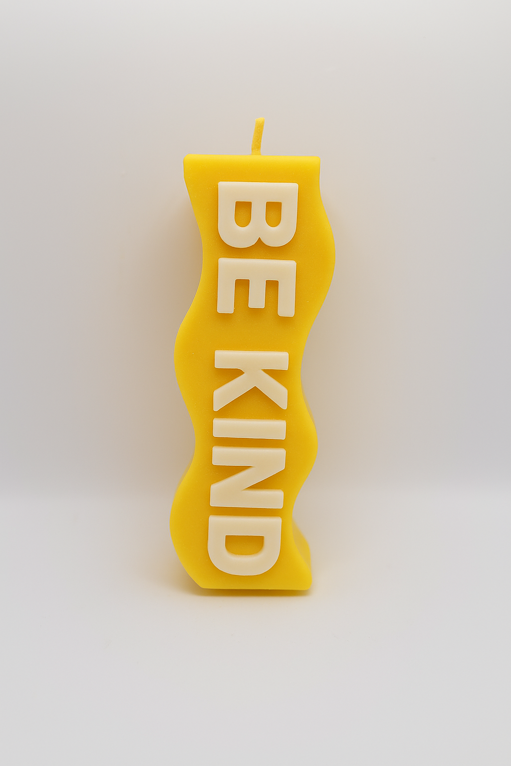 Bright yellow Yellow Be Kind Candle with uplifting "Be Kind" message and fresh lemon scent